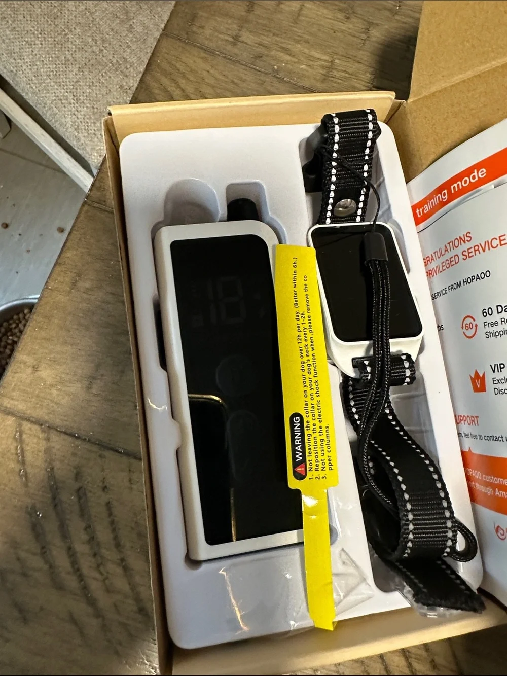 White Body-Mounted Camera Remote with Adjustable Black Strap